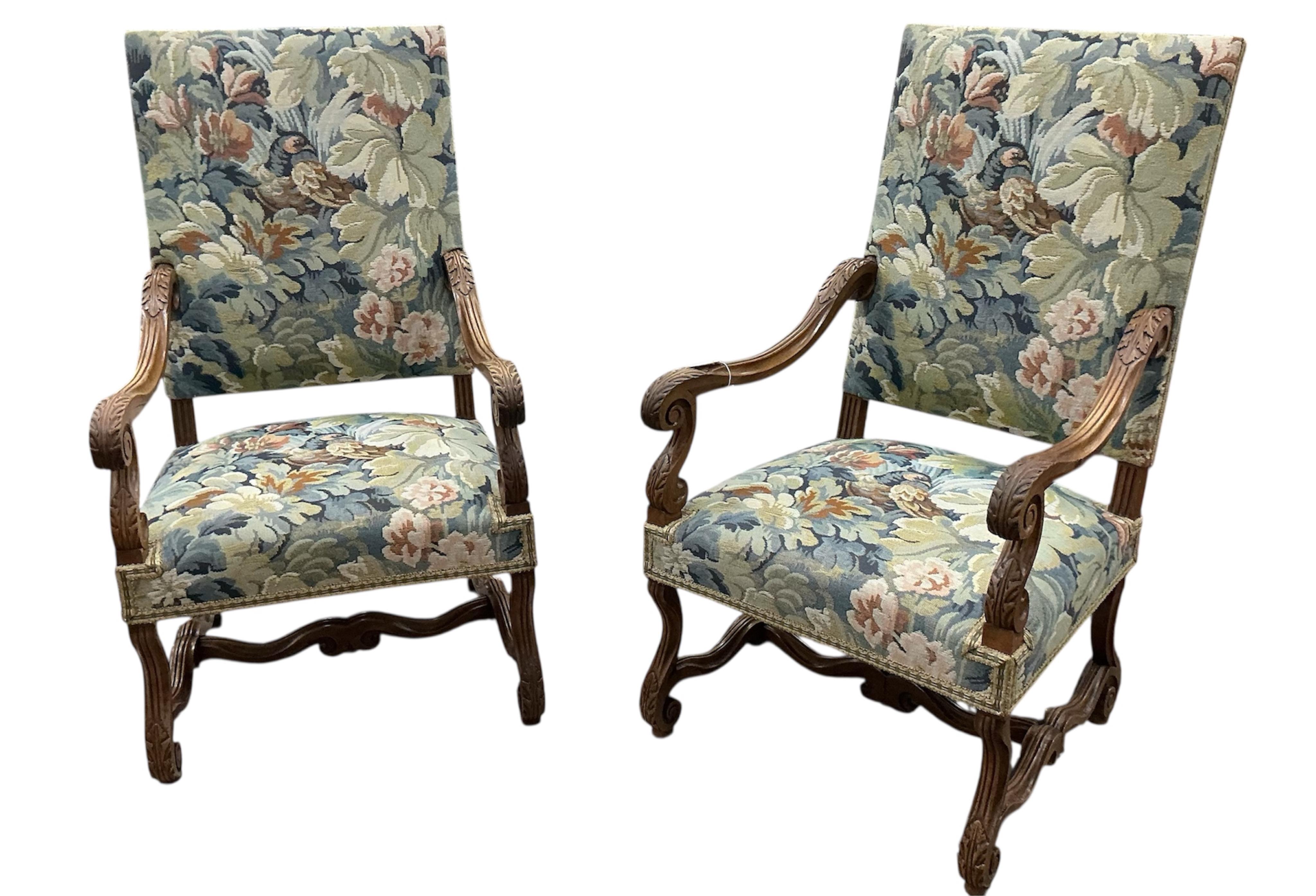 A pair of Louis XIII style walnut armchairs with tapestry upholstery, width 63cm, depth 63cm, height 115cm
